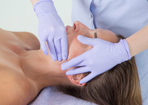 Professional buccal or internal massage of the girl's face