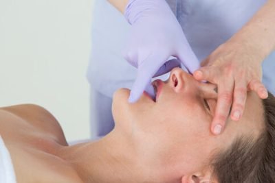 Intraoral massage, intra oral massage, buccal massage, TMJ massage, TMJ treatment at Uma Clinic in Seattle